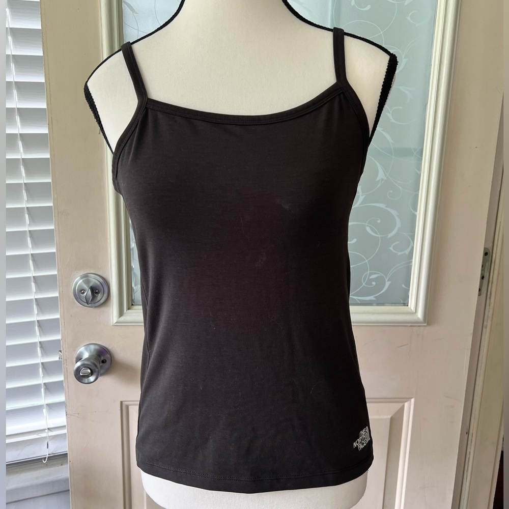 The North Face black tank top size S/P. Built in bra adjustable straps.